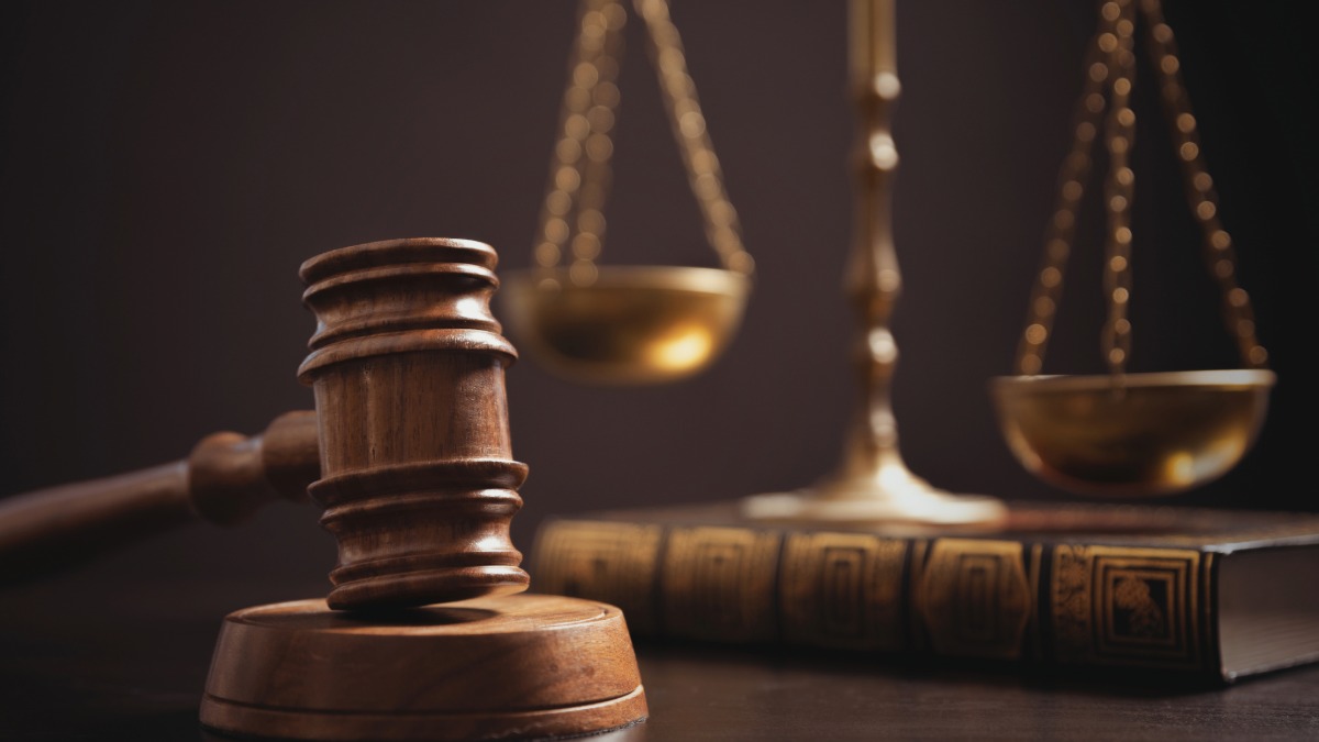 Gavel and scales of justice on a wooden desk representing the FDA July 2026 peptide regulatory review